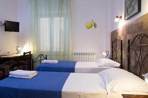 A bed or beds in a room at Le Cinque Novelle