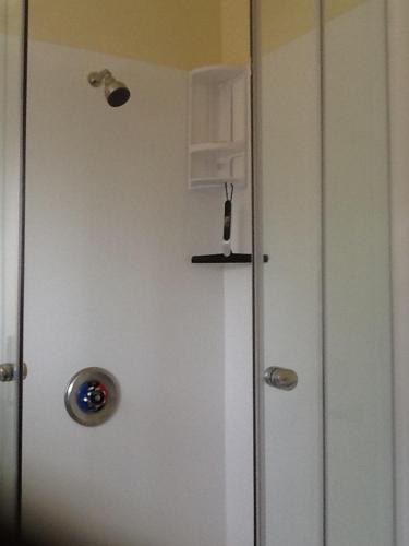a white door with a door knob and a door at River Terrace Cottage in Motueka