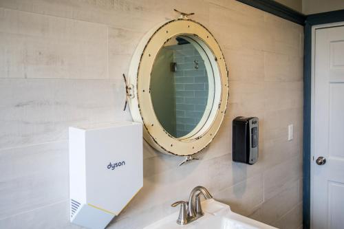 a bathroom with a sink and a mirror at Ocean Park Hotel in Los Angeles