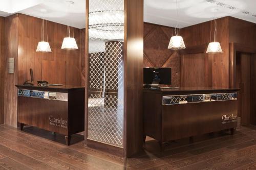 a kitchen with a stove, refrigerator, sink, and dishwasher at Claridge Madrid in Madrid