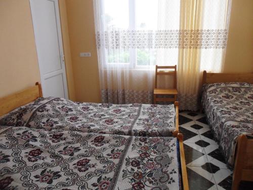 Postel nebo postele na pokoji v ubytování Guest House Nika