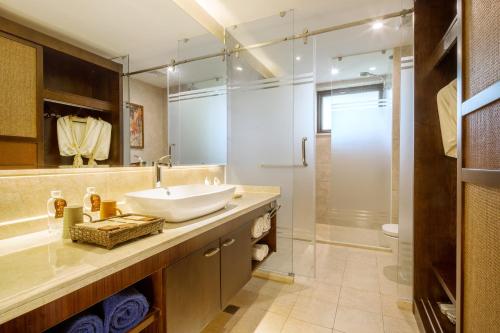 a bathroom with a sink and a shower at Sanya Yalong Bay Villas & Spa in Sanya