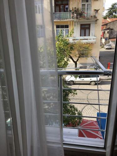 a window with a view of a street at Irma Apartment in Batumi