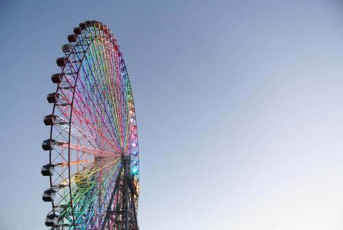 a large ferris wheel with a rainbow at Guest House FUTARENO in Yokohama