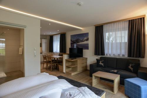 Postel nebo postele na pokoji v ubytování R Appartements Sommerbergbahnen inklusive