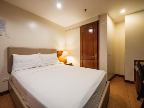Ένα ή περισσότερα κρεβάτια σε δωμάτιο στο The Well Hotel