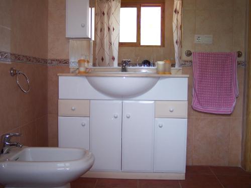 a bathroom with a sink and a toilet at Casa Tere in Miller
