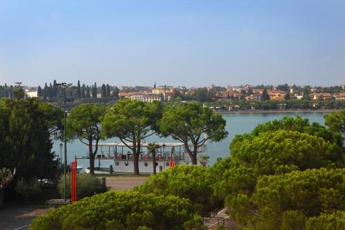 a view of a lake with a boat on the water at Hotel Ristorante Al Fiore in Peschiera del Garda