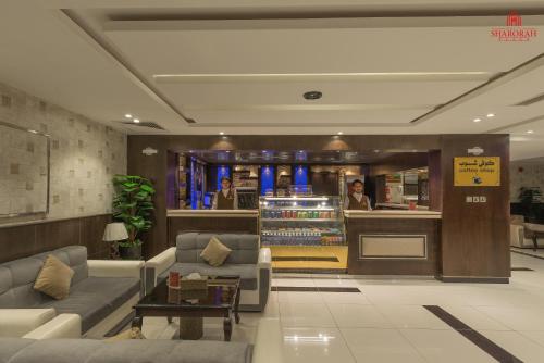 a lobby with couches and a counter in a store at فندق شروره بلازا الفندقية in Sharurah