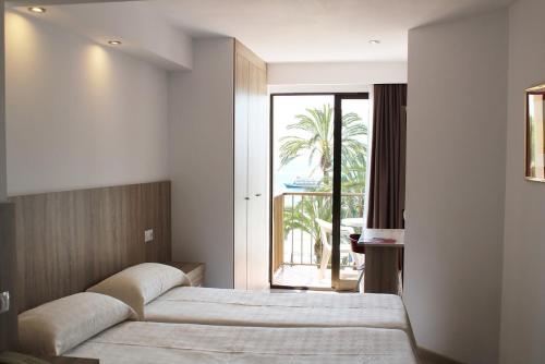 Postel nebo postele na pokoji v ubytování Hotel Montemar