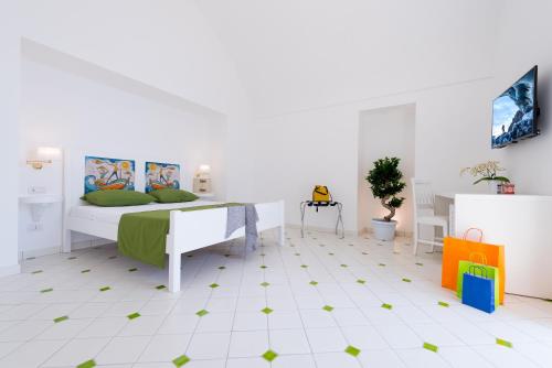 a bedroom with a bed with green stars on the floor at Vista d'Amalfi in Amalfi