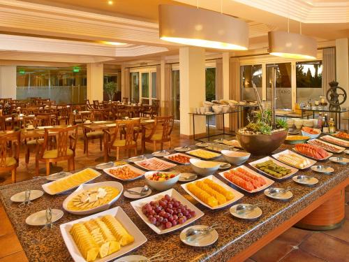 a buffet of food on a table in a restaurant at Ria Park Hotel & Spa in Vale do Lobo