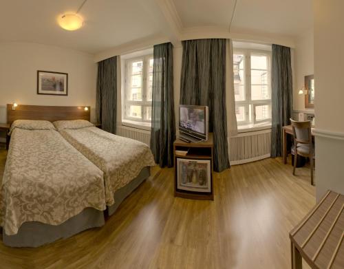 Ένα ή περισσότερα κρεβάτια σε δωμάτιο στο Hotel Anna