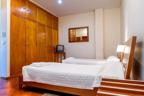 Postel nebo postele na pokoji v ubytování Hostel Carvalho