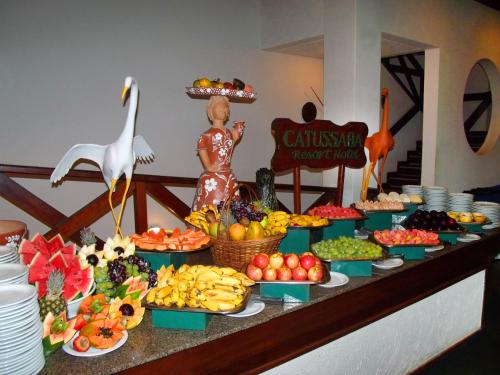 a buffet of fruits and vegetables on a table at Catussaba Resort Hotel in Salvador