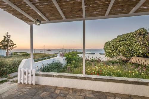 a view of the ocean from the patio of a house at Mandrakia Bliss House in Mandrakia