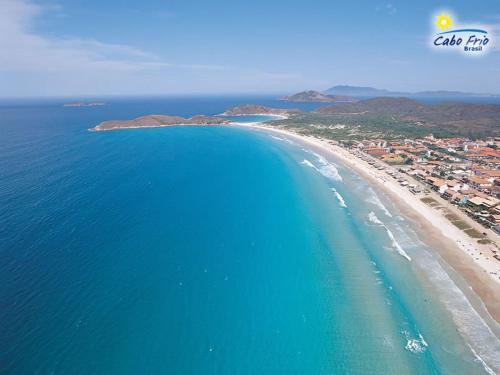 an aerial view of a beach and the ocean at Pousada Mariá in Cabo Frio