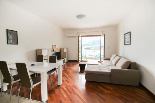 a living room with a couch and a table at Apartmani Svetionik in Budva