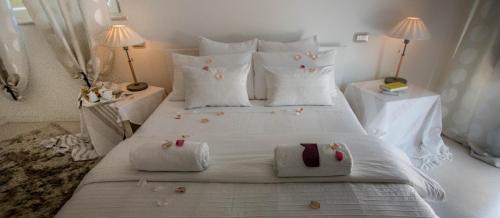 Ένα ή περισσότερα κρεβάτια σε δωμάτιο στο B&B Luna Bianca