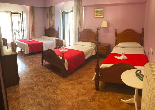 Cama o camas de una habitación en Madrid Playa Rooms