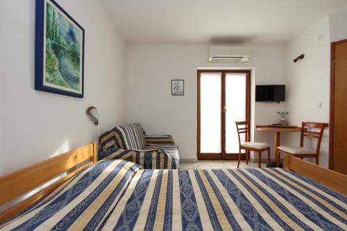 Łóżko lub łóżka w pokoju w obiekcie B&B Villa Velike Stine