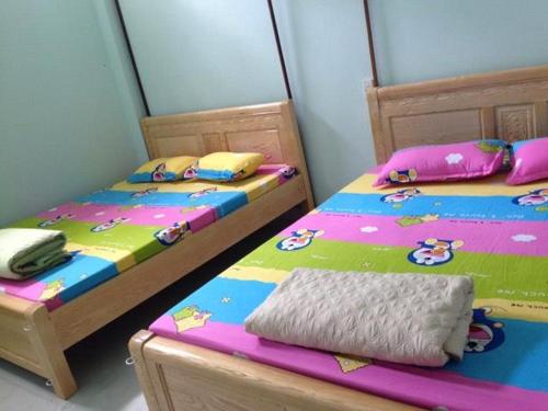 Ένα ή περισσότερα κρεβάτια σε δωμάτιο στο Tom Homestay