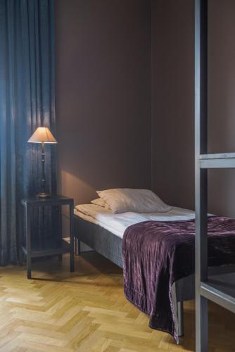 Un ou plusieurs lits dans un hébergement de l'établissement Donners Hotell