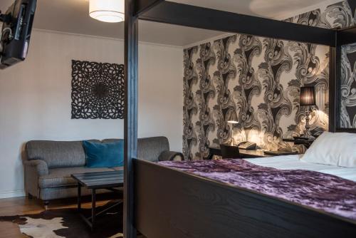 Un ou plusieurs lits dans un hébergement de l'établissement Donners Hotell
