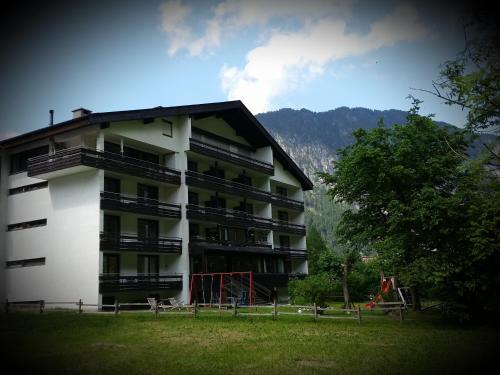 a large building with a playground in front of it at Appartement Haus Zalim in Brand