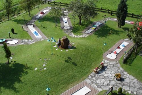 an aerial view of a park with a playground at Hotel Neuwirt in Kirchdorf in Tirol
