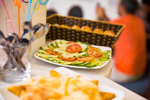a plate of food on a table with a salad at Serene Boutique Hotel & Spa in Hanoi