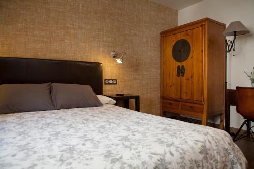 Ένα ή περισσότερα κρεβάτια σε δωμάτιο στο Hostel-Albergue Monte Perdido