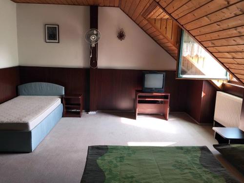 Postel nebo postele na pokoji v ubytování Tahiti Vendégpark