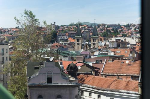a view of a city with roofs and buildings at Amazing Penthouse old town in Sarajevo