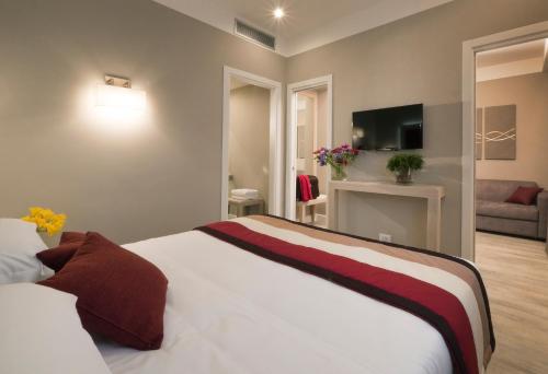 a hotel room with a bed and a living room at Hotel Villa Maria Regina in Rome