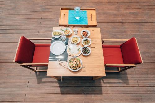 an overhead view of a table with plates of food at The Palmyrah House in Mannar