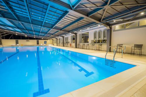 a large swimming pool with blue water at Apollo Beach in Faliraki