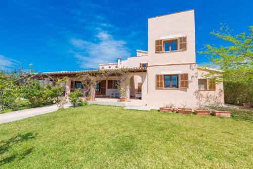 an image of a house with a yard at Vora Pula Golf II in Son Servera