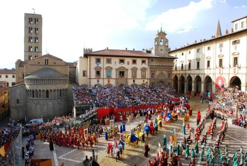 a large crowd of people standing in front of a building at All'Antico Silbule in Capolona