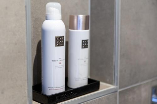 two bottles ofodorizers sitting on a shelf at In het Assendorpje in Zwolle