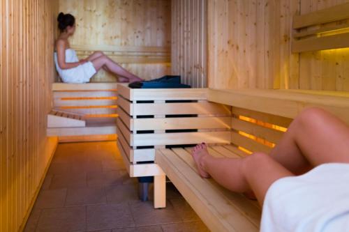 Postel nebo postele na pokoji v ubytování Hotel Ognisty Ptak