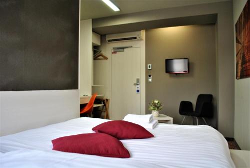 Postel nebo postele na pokoji v ubytování Kongres Hotel Roca