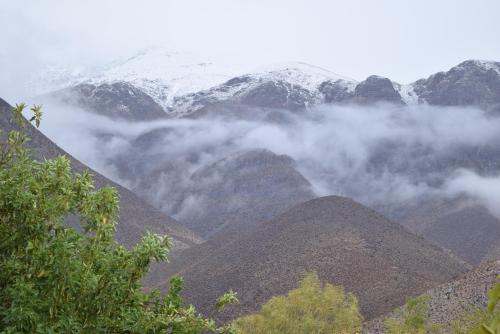 a view of a mountain range with snow covered mountains at Clayhouse Rivadavia in Rivadavia