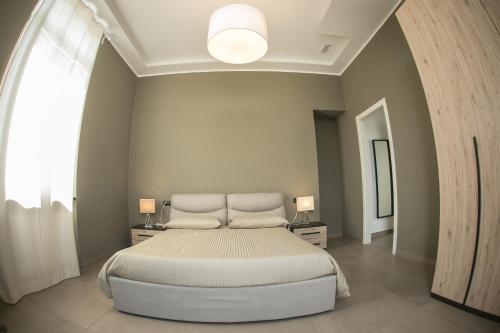 Katil atau katil-katil dalam bilik di Al Tartarughino B&B
