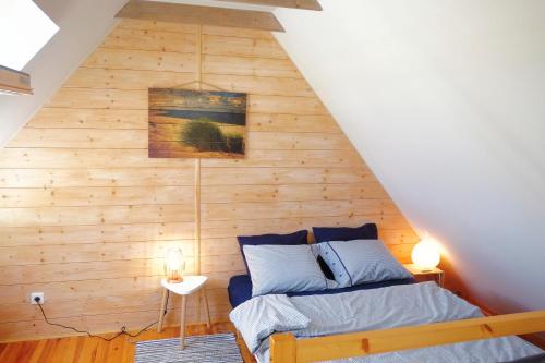 Postel nebo postele na pokoji v ubytování Domek Drewniany