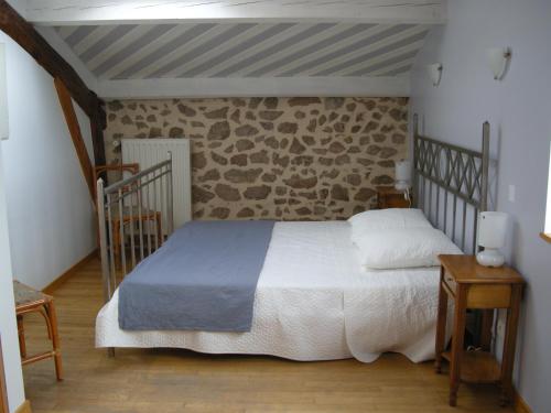 Ένα ή περισσότερα κρεβάτια σε δωμάτιο στο Auberge BRIASSOU