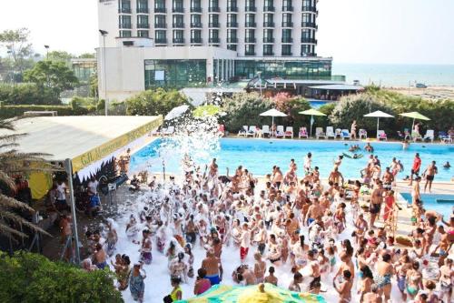 a large crowd of people in a swimming pool at Grand Hotel Montesilvano in Montesilvano