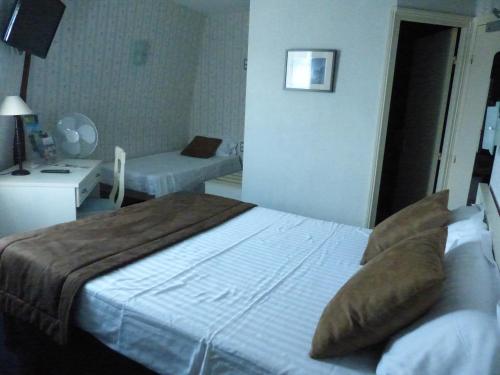 a hotel room with a bed and a couch and a room at Belle Epoque in Chinon