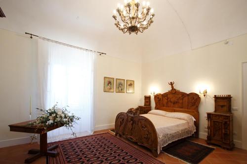 Tempat tidur dalam kamar di Tenuta Corigliano