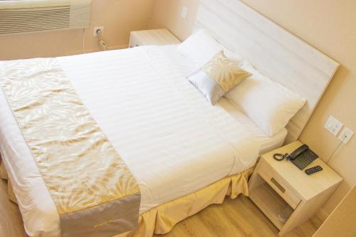 Ένα ή περισσότερα κρεβάτια σε δωμάτιο στο Phoenix Hotel Brooklyn Sunset Park